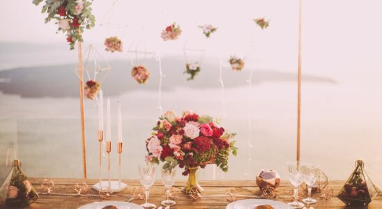 pink and red roses centerpiece near silverwares