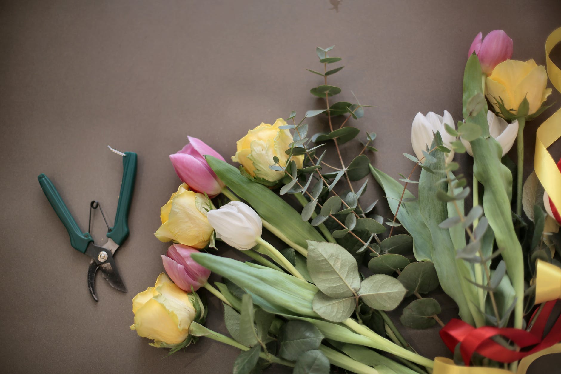 colorful flowers bouquet near pruning scissors