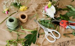 pruners and scissors together with twine in florist shop