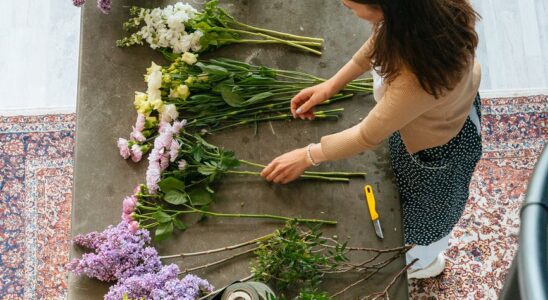 top view of a woman making flower arrangement